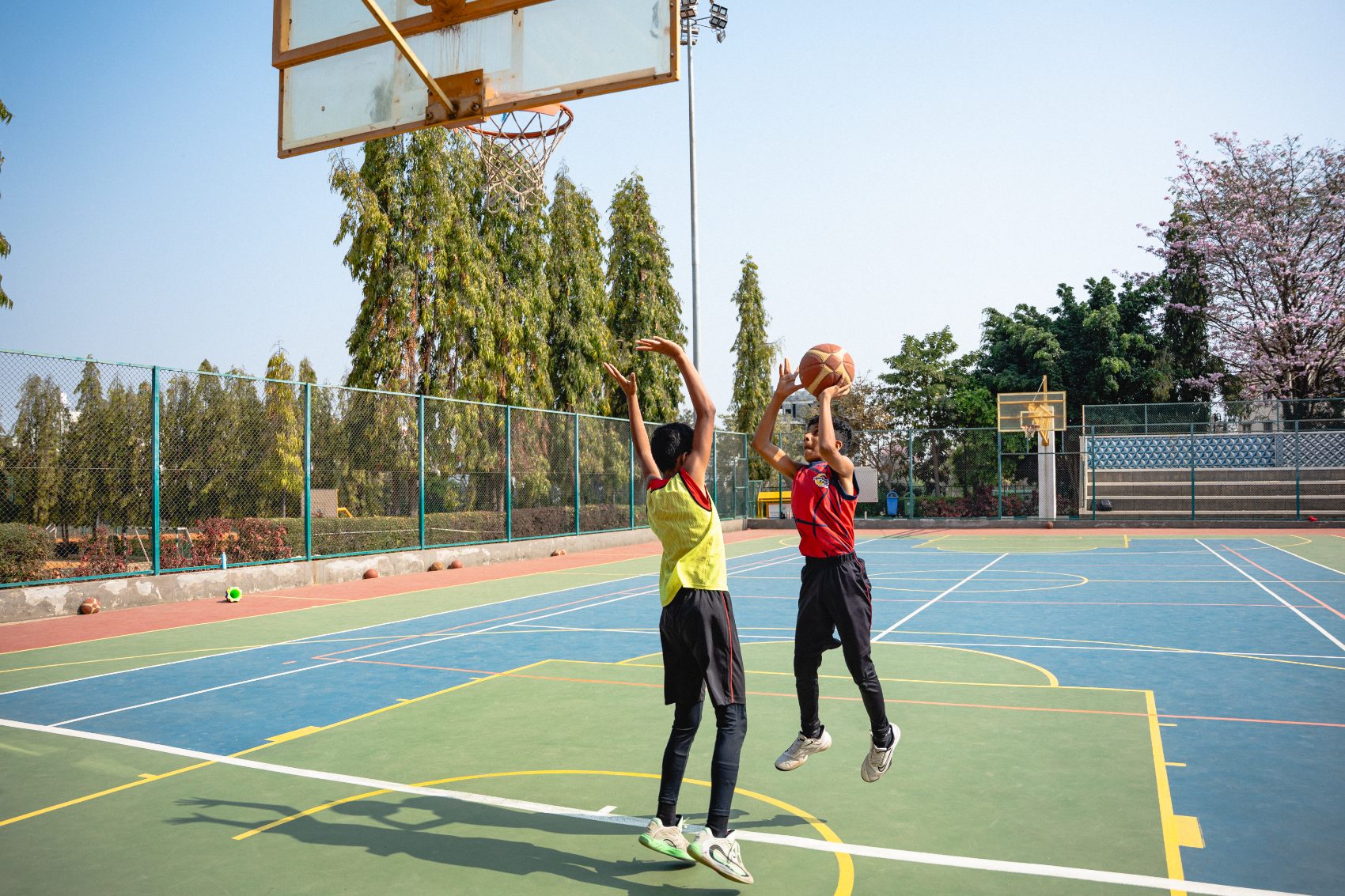 Coach and young athlete on the court